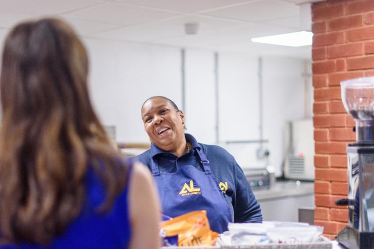 Active Lambeth receptionist talking to a customer